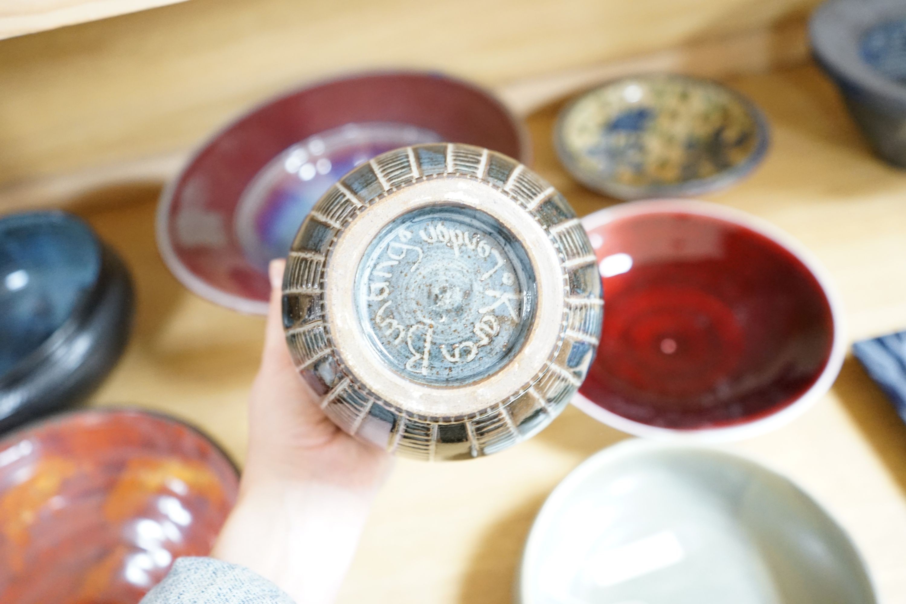 A group of studio pottery vases and dishes to include- 35cm